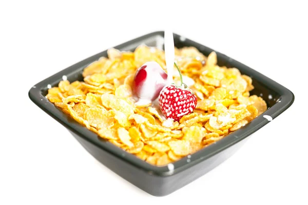 stock image Strawberries and cherries in the bowl of Cornflakes with milk is