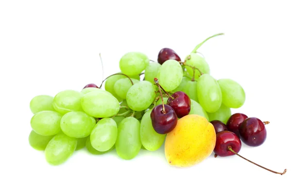 Grapes, cherries and apricots isolated on white — Stock Photo, Image