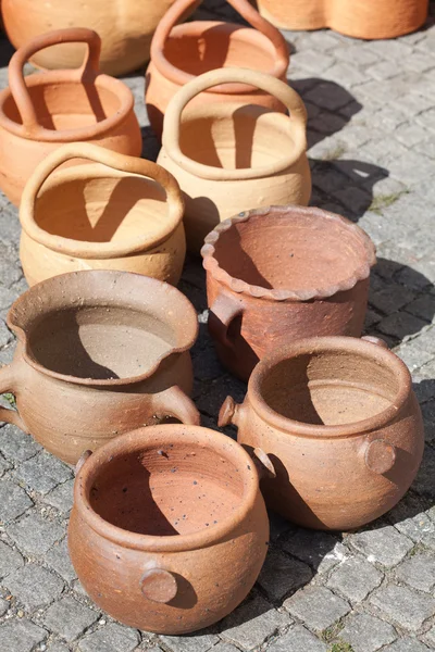 Clay pots on pavement — Stock Photo, Image