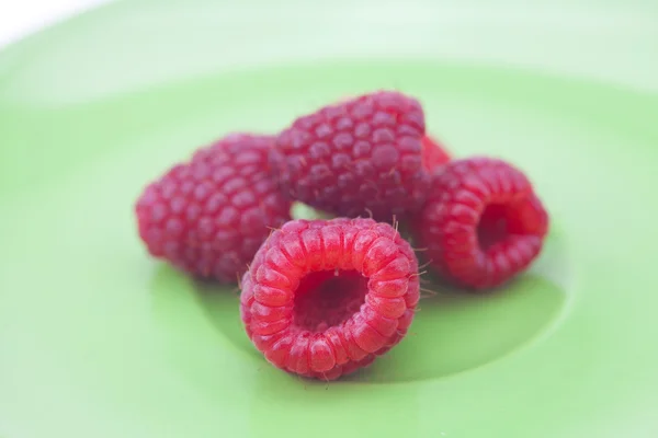 Raspberries on a plate — Stock Photo, Image