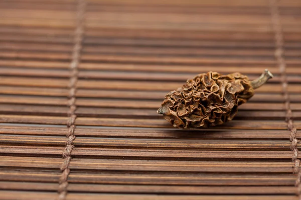 Dried walnut on a bamboo mat — Stock Photo, Image