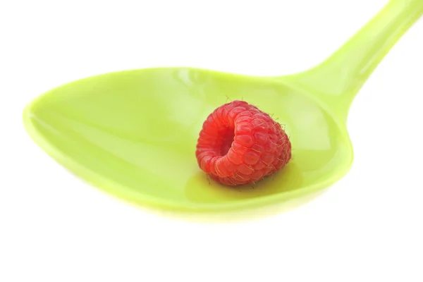 Raspberries in a spoon isolated on white — Stock Photo, Image
