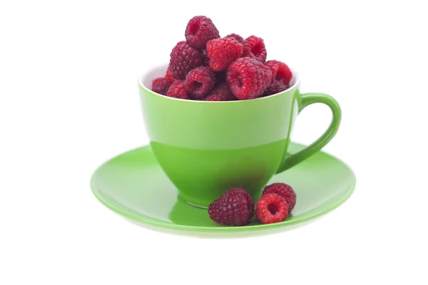 Raspberry, saucer and cup is isolated on a white — Stock Photo, Image