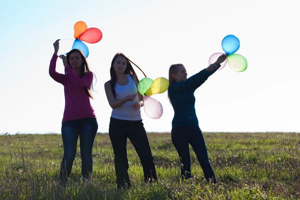 Beautiful teenager woman with a balloons outdoors — Stock Photo, Image