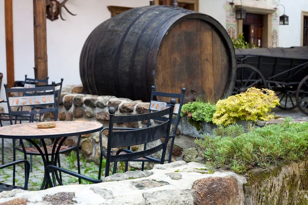 stock image Forged furniture cafe and a large beer keg