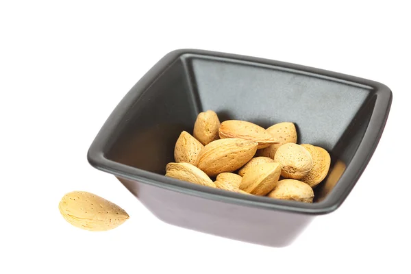 Almonds in a bowl isolated on white — Stock Photo, Image