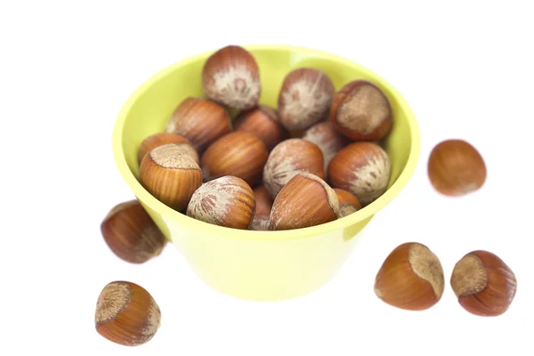 Hazelnuts in a bowl isolated on white — Stockfoto