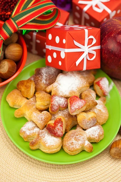 stock image Dish, cookies, nuts, apple, bows, boxes, gifts, Christmas balls