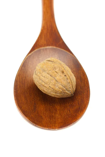 Walnut in een houten lepel geïsoleerd op wit — Stockfoto