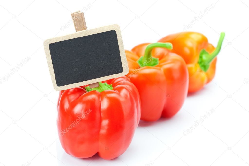 Red pepper and board isolated on white