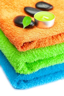 Background of the three multi-colored bath towels, black spa sto clipart