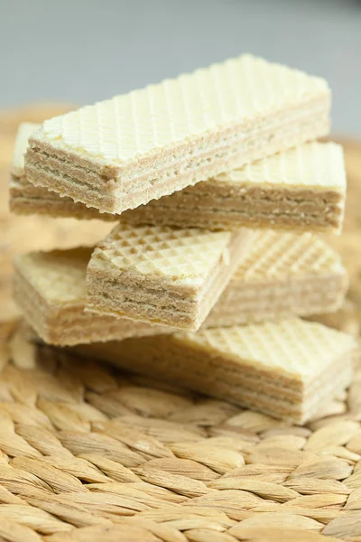 Sweet wafers lying on a wicker mat — Stock Photo, Image