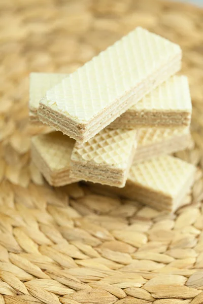 Sweet wafers lying on a wicker mat — Stock Photo, Image