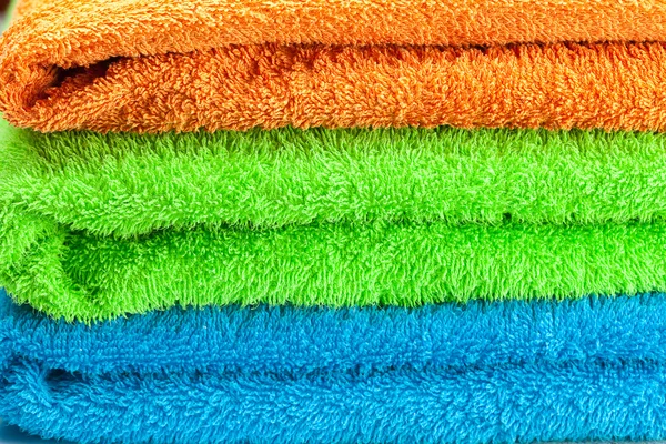 Sfondo dei tre asciugamani di spugna multicolore — Foto Stock