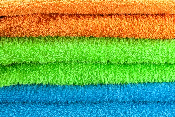 Fundo das três toalhas terry multi colorido — Fotografia de Stock