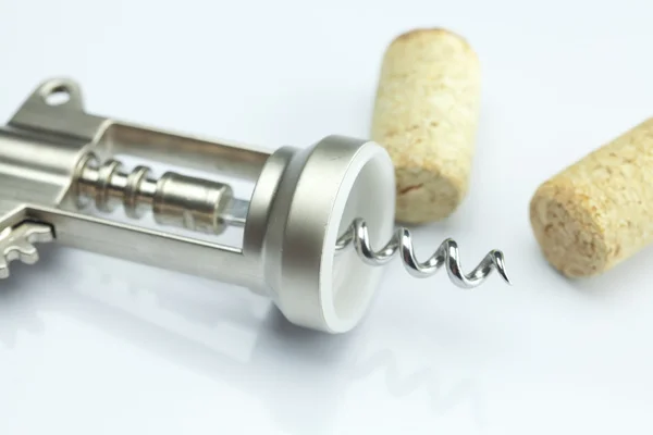 Background of the mountains of wine corks and a corkscrew — Stock Photo, Image