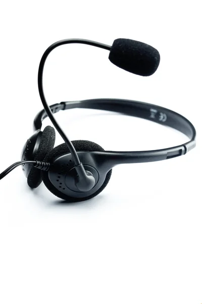 A black headset is isolated on white — Stock Photo, Image