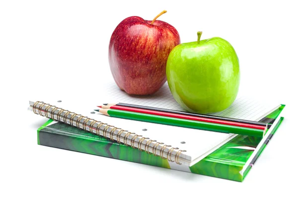 Apple, notebooks and pencils isolated on white — Stock Photo, Image