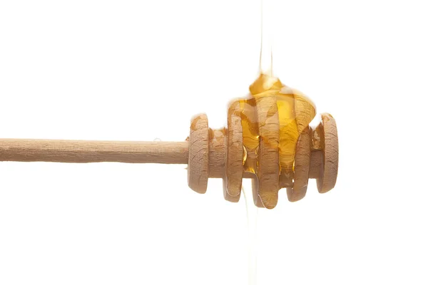 Vasthouden aan honing is geïsoleerd op wit — Stockfoto