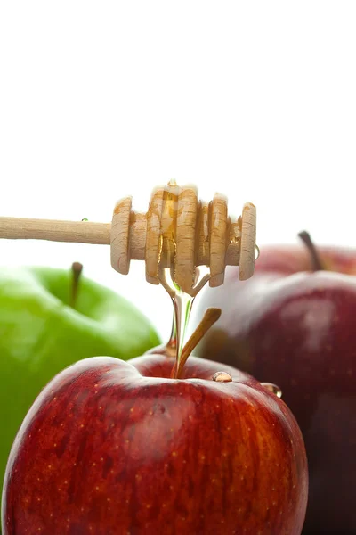 Bal ve üzerinde beyaz izole elma sopa — Stok fotoğraf