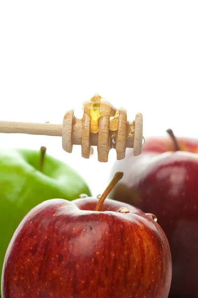 stock image Stick to honey and apples isolated on white