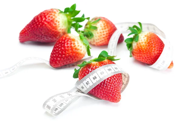 Big juicy red ripe strawberries and measure tape isolated on whi — Stock Photo, Image