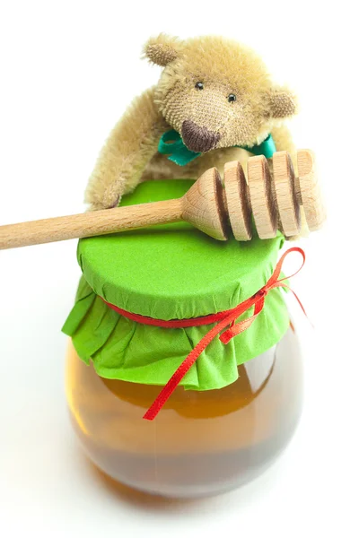 Teddybär, Stick auf hohey und Glas Honig isoliert auf weiß — Stockfoto