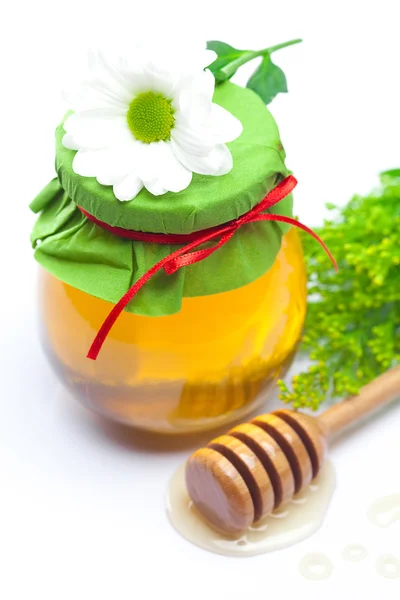 Stick to hohey ,flower and jar of honey isolated on white — Stock Photo, Image