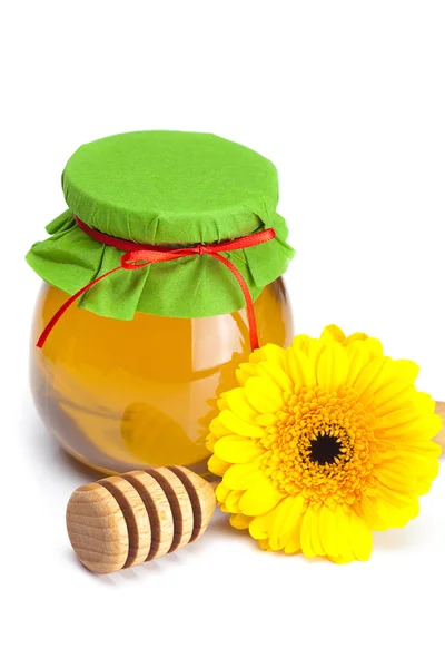 Furar a hohey, flor e frasco de mel isolado em branco — Fotografia de Stock