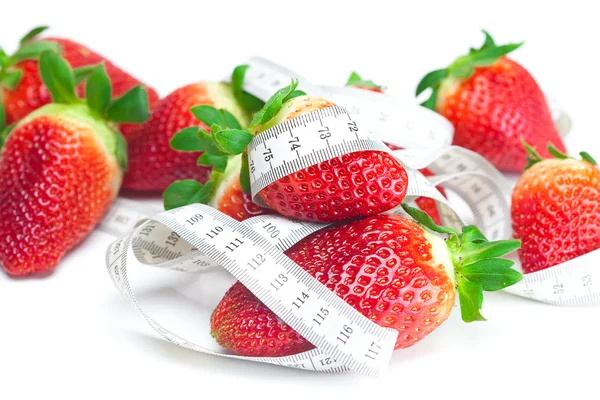 Big juicy red ripe strawberries and measure tape isolated on whi Stock Photo