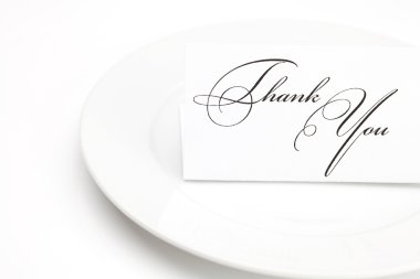 Plate with card signed thank you isolated on white clipart