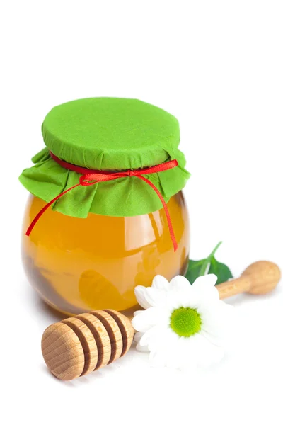 Držet hohey, květ a sklenice medu izolovaných na bílém — Stock fotografie