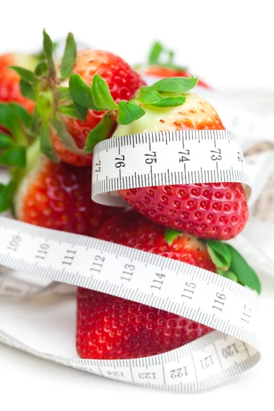 Big juicy red ripe strawberries and measure tape isolated on whi — Stock Photo, Image