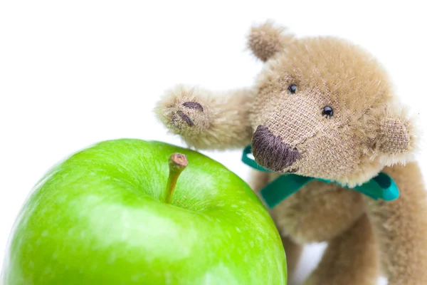 Teddy bear and apple isolated on white — Stock Photo, Image