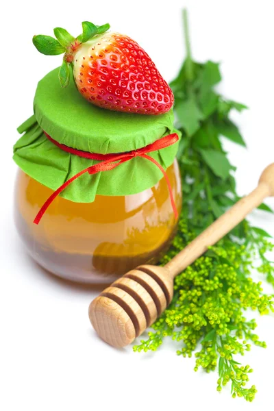Stick to hohey,strawberries and jar of honey isolated on whit — Stock Photo, Image