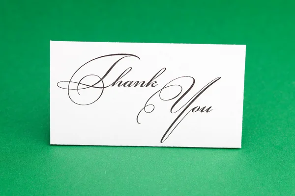 Card signed thank you on green background — Stock Photo, Image