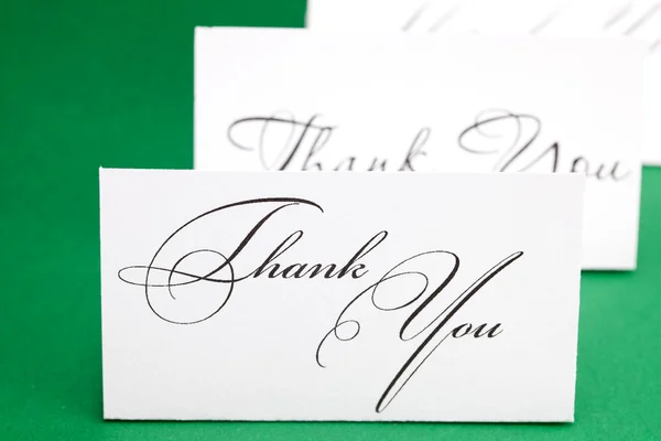Card signed thank you on green background — Stock Photo, Image