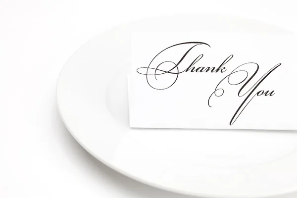 Plate with card signed thank you isolated on white — Stock Photo, Image