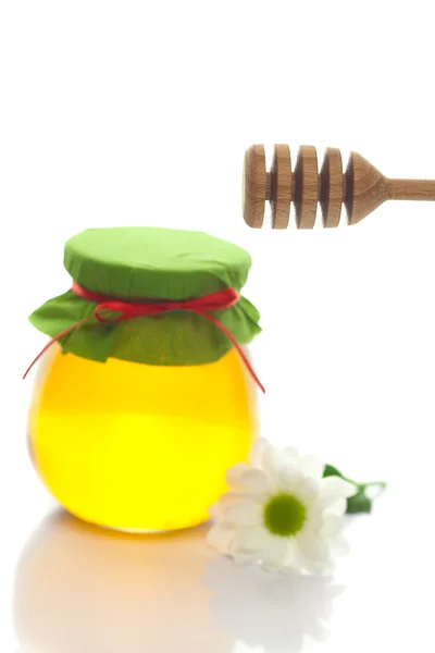 Stick to hohey ,flower and jar of honey isolated on white — Stock Photo, Image