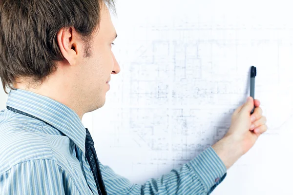 Young man architect presenting a project — Stock Photo, Image