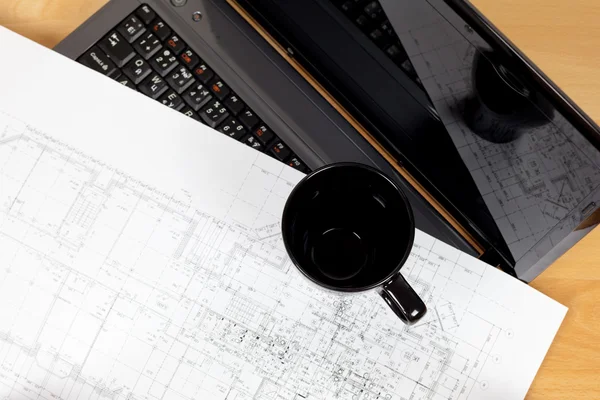 Background of the architectural drawings,cup and laptop — Stock Photo, Image