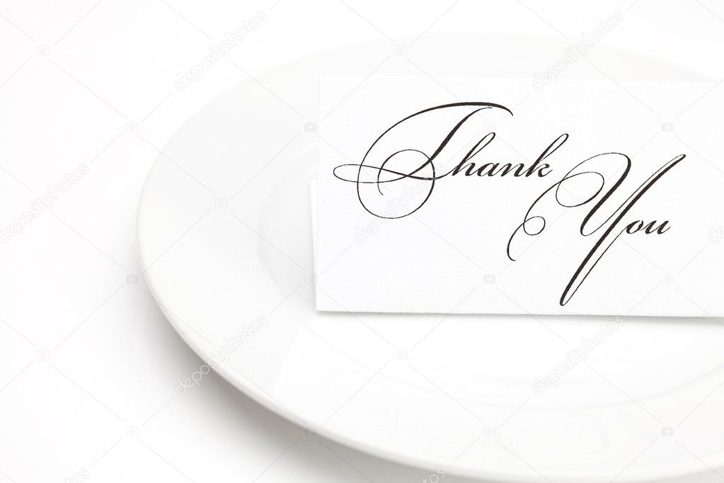 Plate with card signed thank you isolated on white