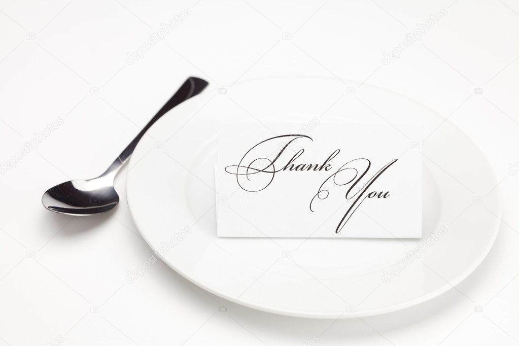 Plate with card signed thank you isolated on white