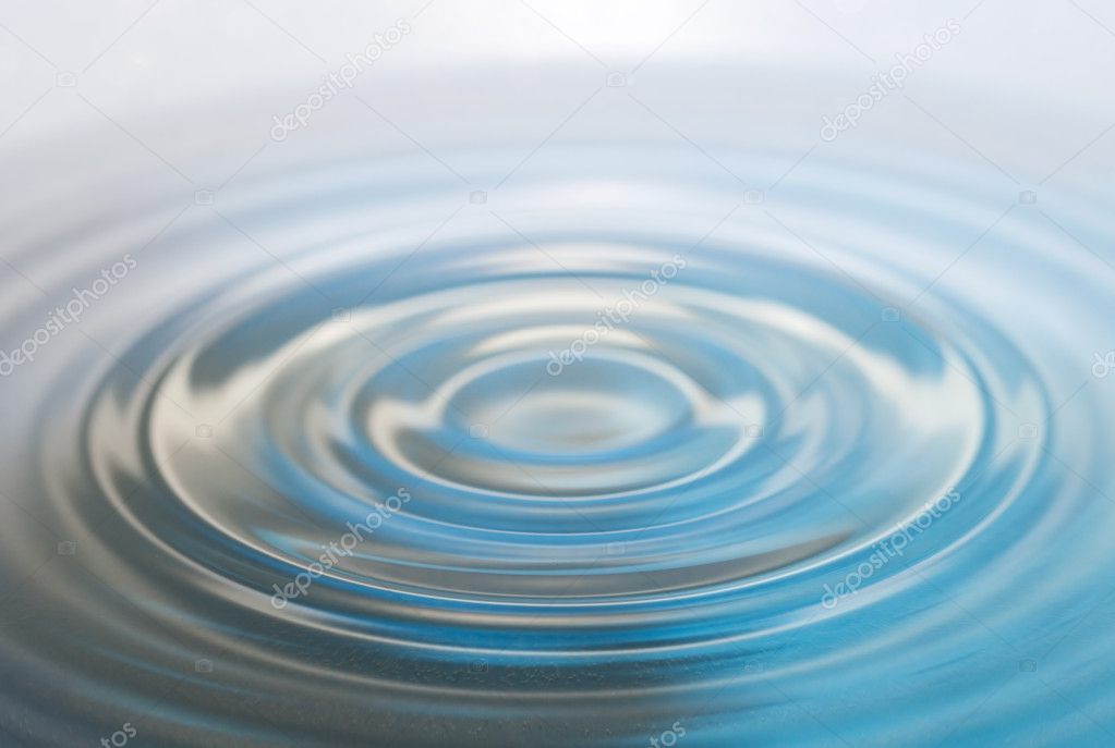 Water drop and splash on a blue background