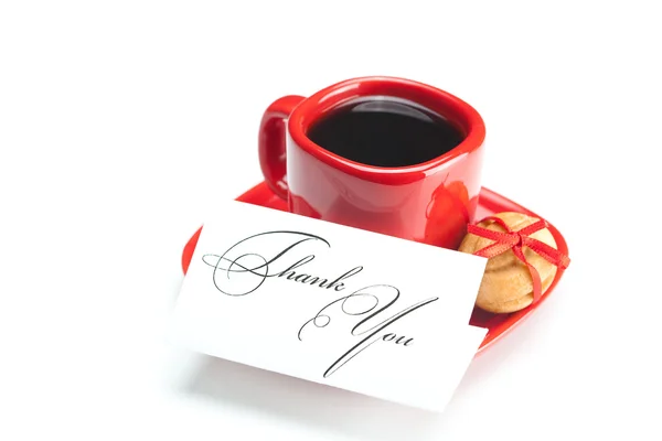 Tasse avec café, carte de remerciement, noix de gâteau et ruban isolé sur — Photo