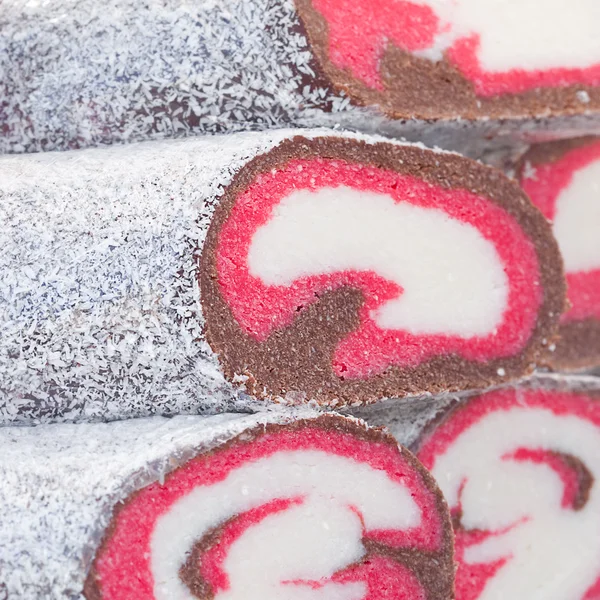 Background of coconut rolls at the fair — Stock Photo, Image