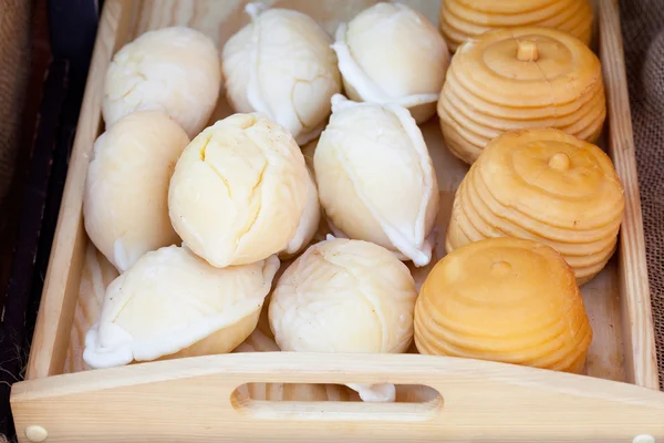 Background of smoked cheese at the fair — Stock Photo, Image