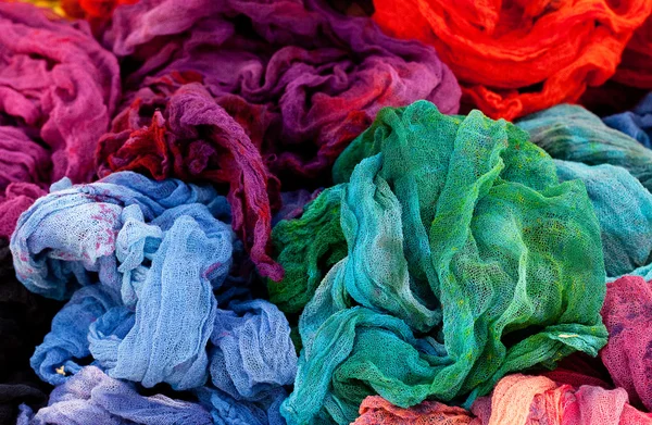 Background of multicolored fabric at the fair — Stock Photo, Image
