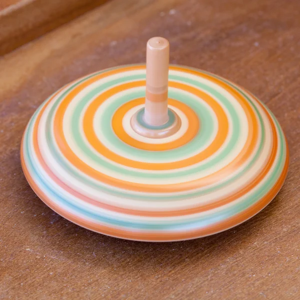 Wooden spinning top at the fair — Stock Photo, Image