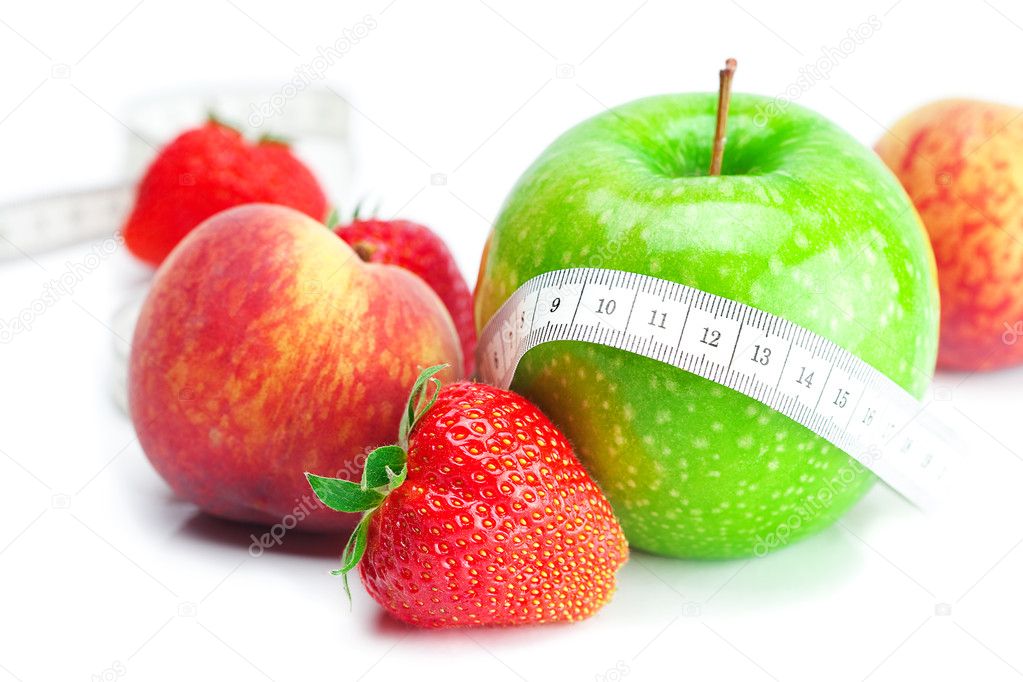 Big juicy red ripe strawberries,apple,peach and measure tape iso